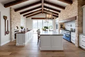 Rustic kitchen with exposed beams and island.