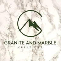 Granite and Marble Creations logo on marble.