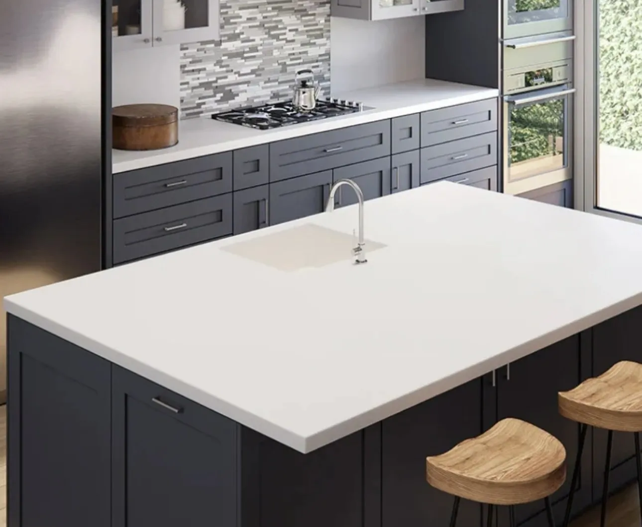 Modern kitchen with large island and stools.