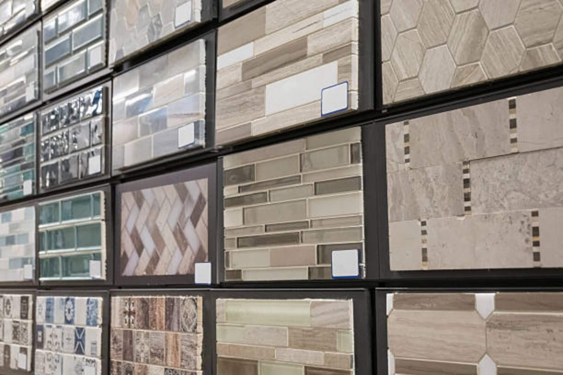 Assorted tile samples displayed on a wall.