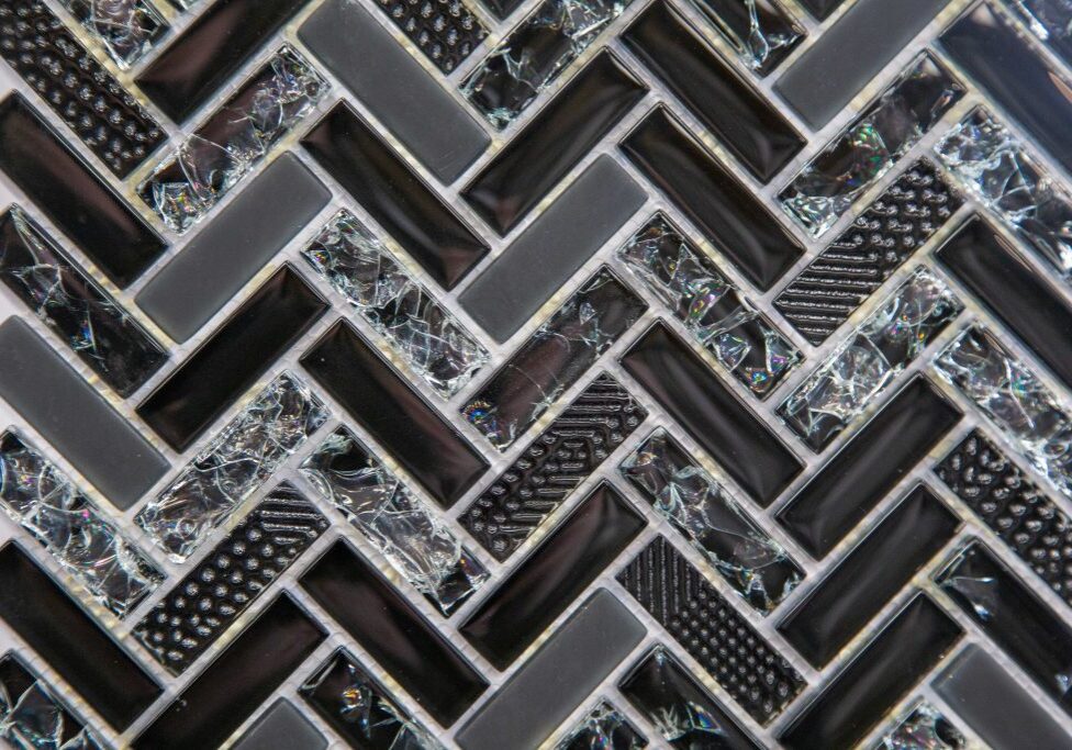 Black and silver geometric mosaic tile pattern.